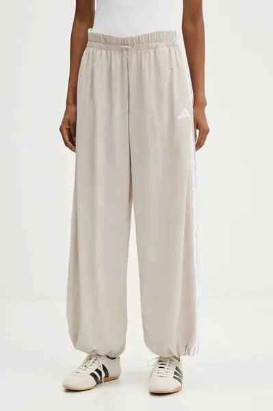 Tepláky adidas Essentials béžová barva, s aplikací, JC8168