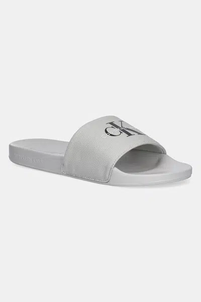 Pantofle Calvin Klein Jeans SLIDE MONOGRAM pánské, šedá barva, YM0YM01271