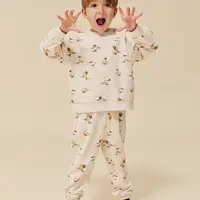 Dětské bavlněné tepláky Konges Sløjd béžová barva, s potiskem