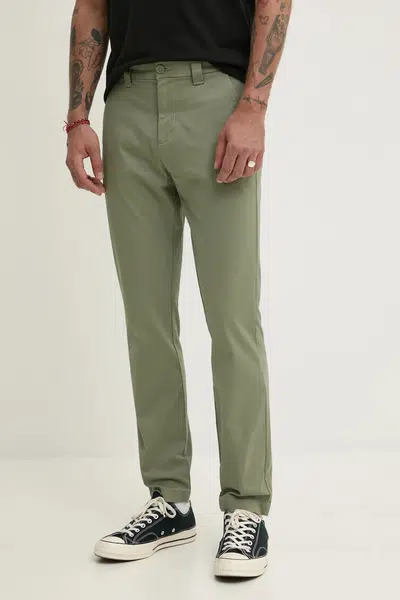 Kalhoty Tommy Jeans pánské, zelená barva, přiléhavé, DM0DM20282