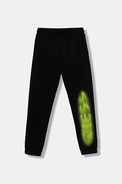Dětské bavlněné tepláky Guess černá barva, s potiskem, L5YQ11 KAD74