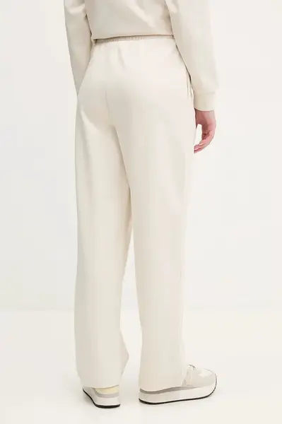 Tepláky Puma dámské, béžová barva, hladké, 629774