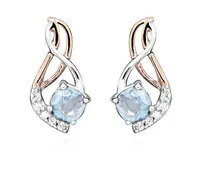 MOISS Nadčasové stříbrné bicolor náušnice s topazy EG000076