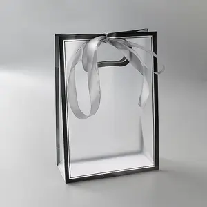 Rectangle Plastic Packaging Gift Bags with Hole Handle and Silk Ribbon