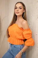 Oranžová halenka přes rameno