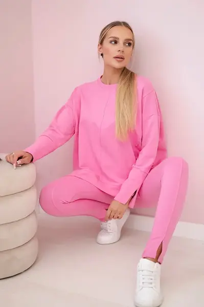 Complete with an oversized blouse in light pink color