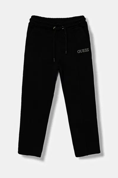 Dětské bavlněné tepláky Guess černá barva, s aplikací, J5YQ17 KAV34