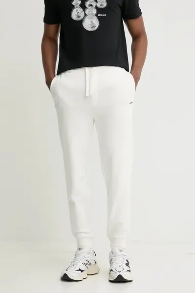 Bavlněné tepláky HUGO Dayote232 béžová barva, 50489617