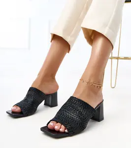 Gemre Black heeled sandals with woven straps Gamboa