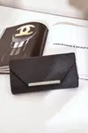 marka niezdefiniowana Elegantná Kabelka Klapka S Leskom Čierna Remiala