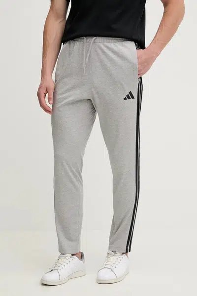 Tepláky adidas Essentials šedá barva, JE6428