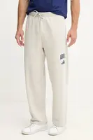 Tepláky adidas Collegiate pánské, béžová barva, s potiskem, JM9177