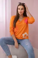 Sweater blouse with orange floral pattern