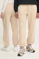 Bavlněné tepláky Pangaia béžová barva