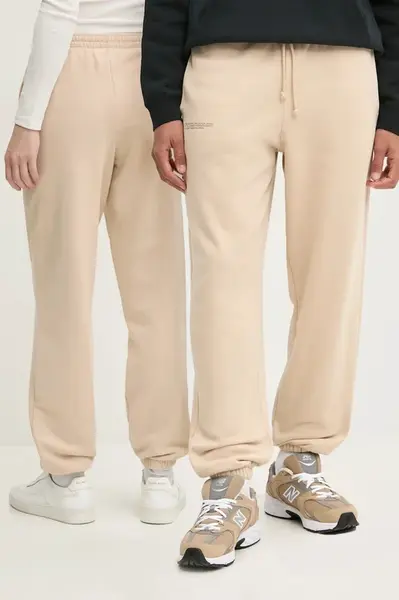 Bavlněné tepláky Pangaia béžová barva