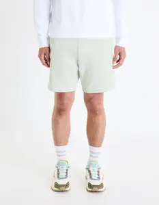 Svetlo zelené pánske teplákové kraťasy Celio Toshort