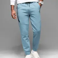 Ombre Men's sweatpants with ribbed cuffs and decorative zipper - light blue