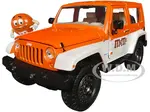 2007 Jeep Wrangler Orange Metallic and White and Orange M&amp;M Diecast Figure "M&amp;Ms" "Hollywood Rides" Series 1/24 Diecast Model Car by Jada