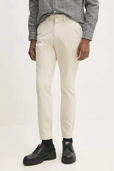Kalhoty Tommy Jeans pánské, béžová barva, přiléhavé, DM0DM20282