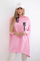 Oversized sweatshirt with asymmetrical sides in light pink color