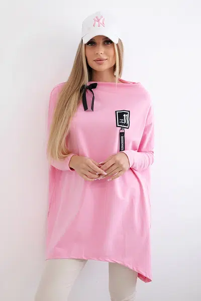 Oversized sweatshirt with asymmetrical sides in light pink color