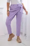 Trousers tied with an asymmetrical light purple front