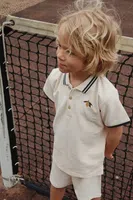 Dětská bavlněná polokošile Konges Sløjd FLORIAN POLO SHIRT GOTS béžová barva, s aplikací, KS102412