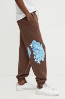 Bavlněné tepláky Puma hnědá barva, s potiskem, 630295