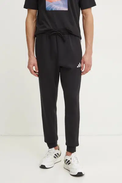 Tepláky adidas Essentials černá barva, vzorované, JD1861