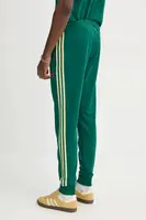 Tepláky adidas Originals SST TP zelená barva, s aplikací, JP1224