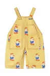 Dětské lacláče Tinycottons BABY READERS DUNGAREE žlutá barva, s potiskem, SS25-195