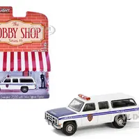 1985 GMC Suburban 2500 "New York City Transit Police Department" White with Blue Stripes and Police Officer Figure "The Hobby Shop" Series 16 1/64 Di