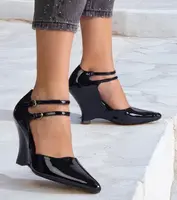 Gemre Black patent wedge pumps with buckles Vizario