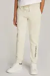 Dětské bavlněné tepláky Calvin Klein Jeans REGULAR JOGGER béžová barva, s potiskem, IU0IU00681