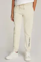 Dětské bavlněné tepláky Calvin Klein Jeans REGULAR JOGGER béžová barva, s potiskem, IU0IU00681
