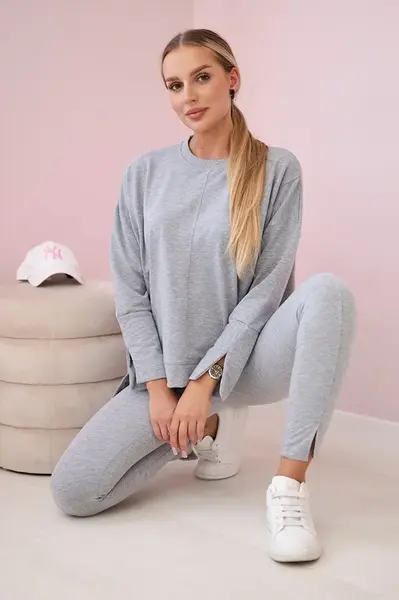 Complete with an oversized blouse in gray color