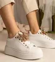 Gemre White sneakers adorned with a butterfly and rhinestones Kariba