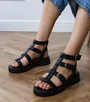 marka niezdefiniowana Black gladiator sandals fastened at the ankle Badana