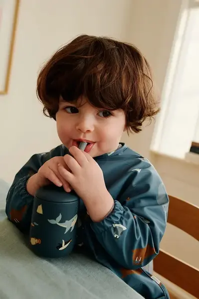 Dětská pláštěnka Liewood Merle Printed Cape Bib