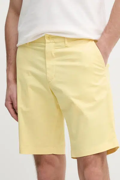 Kraťasy Tommy Hilfiger pánské, žlutá barva