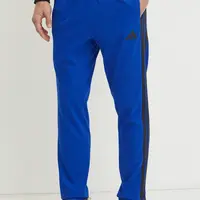 Tepláky adidas Essentials modrá barva, vzorované, JE6432
