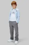 Dětské bavlněné kalhoty Calvin Klein Jeans šedá barva, IB0IB02571