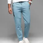 Ombre Men's sweatpants with ribbed cuffs and decorative zipper - light blue