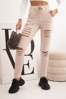 Kesi Dámske bavlnené nohavice s roztrhnutiami a gumou v páse béžové