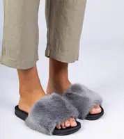 Gemre Gray flip-flops with Manny fur