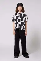 Dětské kalhoty Dkny černá barva, hladké, D62276