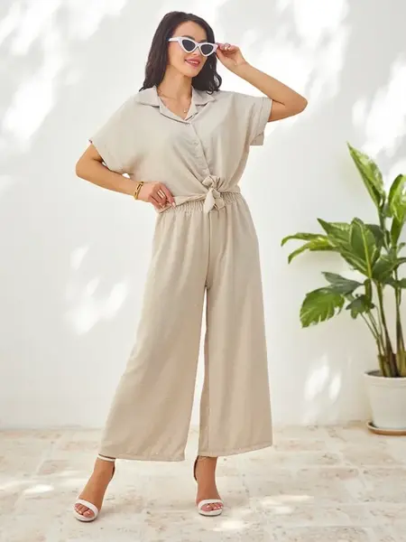 Resti Women's set with a tied short-sleeve shirt and flared pants with rhinestones