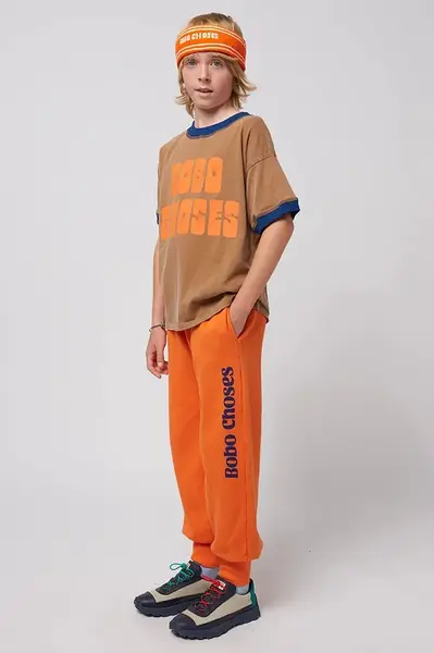 Dětské bavlněné tepláky Bobo Choses oranžová barva, s potiskem, 125AC140