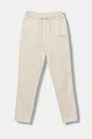 Dětské bavlněné tepláky Guess béžová barva, s aplikací, J5YQ17 KAV34