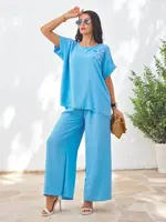 Resti Women's set with short sleeves, decorative flower, and wide pants